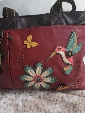 Adorable Chala tote bag featuring a colorful hummingbird and floral applique